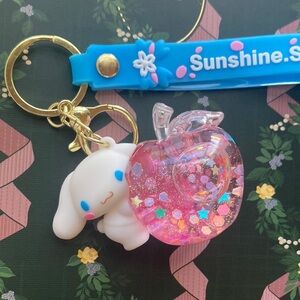 Cinnamoroll Keychain holding glitter filled Apple